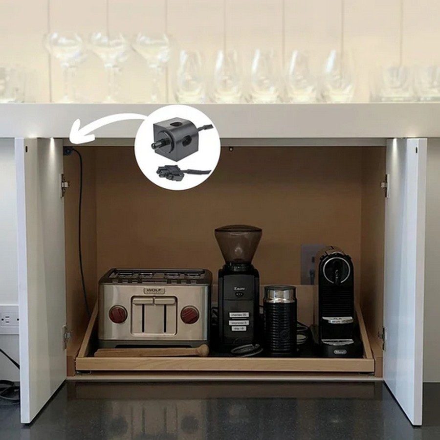 Under cabinet kitchen counter with a toaster coffee grinder and espresso machine a circular inset shows a drill attachment for reference likely a tool